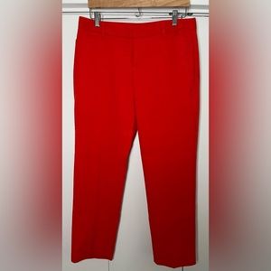 Slim cropped red-orange dress pants from the Gap.